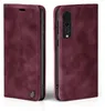 A burgundy flip case for a smartphone is shown from two angles, front and back. Produktbild-Vorschau
