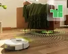 A robot vacuum cleaner is shown cleaning a wooden floor next to a sofa. A floor plan overlay is visible in the top right corner. Anteprima dell’immagine prodotto