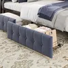 A close-up view of a bed with storage baskets underneath, showcasing bedding and storage solutions. Náhled obrázku produktu