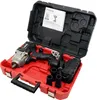 An open red and black tool case containing a cordless impact wrench, battery, charger, and manual. Produktbild-Vorschau