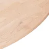 A close-up view of a light-colored wooden surface, likely a tabletop or countertop, with visible wood grain and plank construction. The edge of the surface curves gently. Produktbild-Vorschau