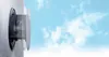 A ventilation component mounted on a textured wall, with a sky and clouds in the background. Anteprima dell’immagine prodotto