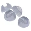 Four transparent silicone protectors for hairpin legs, arranged on a white background. Podgląd zdjęcia produktu