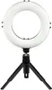 A ring light with a tripod stand. Produktbild-Vorschau