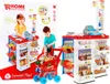 A toy supermarket playset with two children interacting with it, shown on a white and red background with marketing graphics. Voir les images du produit