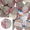 A pile of jar lids with a red and white checkered pattern and a wooden texture, with a small inset image of one lid and a recipe booklet. Podgląd zdjęcia produktu