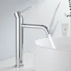 A chrome faucet with water running into a white sink. Anteprima dell’immagine prodotto