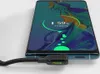 A smartphone is plugged into a charger cable, showing the charging status on its screen. Anteprima dell’immagine prodotto