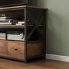 A close-up view of a TV stand with electronic equipment and drawers. Podgląd zdjęcia produktu