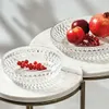 Two crystal bowls filled with fruit, placed on marble tables. Podgląd zdjęcia produktu