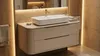 A modern bathroom vanity with a sink and faucet. Náhľad obrázku produktu
