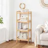 A wooden shelf unit with books and decorative items in a living room setting. Produktbild-Vorschau