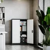 An open metal cabinet filled with files and books, placed in an office setting. Produktbild-Vorschau
