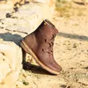 A brown boot is placed on a rocky, outdoor surface. Voir les images du produit