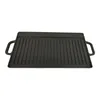 A cast iron grill plate with raised ridges and handles on a white background. Produktbild-Vorschau