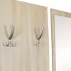 A close-up view of a wooden wall panel with two metal coat hooks and a partial view of a mirror frame. Produktbild-Vorschau