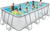 A group of people are enjoying themselves in an above-ground rectangular swimming pool. Anteprima dell’immagine prodotto