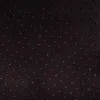 A close-up view of a dark fabric with a pattern of small, raised dots. Produktbild-Vorschau