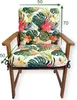 A chair cushion with a floral pattern on a wooden chair. Produktbild-Vorschau