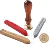 A collection of wax seal stamps and wax sticks arranged on a white background. Voir les images du produit