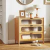 A wooden dresser with three drawers is placed in a room, with a lamp and framed pictures on top. Podgląd zdjęcia produktu
