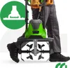 A person is operating a green and gray electric garden tiller. Náhľad obrázku produktu