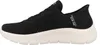 A side view of a black Skechers slip-on shoe with a white sole. Náhľad obrázku produktu