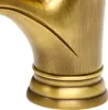 Close-up of a brass-colored faucet base with a decorative band and a curved spout. Podgląd zdjęcia produktu