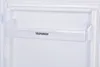 Close-up of a clear plastic shelf inside a white refrigerator. Produktbild-Vorschau