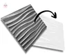 Two 3D wall panels with a wavy pattern are shown, one in gray and one in white, with an arrow indicating a transition or comparison. Produktbild-Vorschau