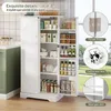 A white storage cabinet with its doors open, displaying various kitchen items like bottles, jars, and plates, next to a kitchen counter. Náhľad obrázku produktu