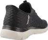 A rear view of a black and gray Skechers slip-on shoe with a white sole. Náhled obrázku produktu
