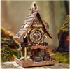 A 3D wooden puzzle cuckoo clock in a forest-like setting. Náhľad obrázku produktu