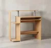 A light brown computer desk with a pull-out keyboard tray and shelves, set against a textured gray wall. Produktbild-Vorschau