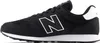 A side view of a black New Balance sneaker with a white 'N' logo. Voir les images du produit