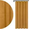 A close-up view of a mustard yellow velour curtain hanging from a black curtain rod, with a detailed texture shown on the left side of the image. Náhled obrázku produktu