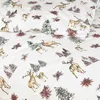 A close-up view of a white duvet cover with a repeating pattern of deer and pine trees. Produktbild-Vorschau