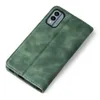 A green flip case for a smartphone is shown on a white background. Produktbild-Vorschau