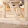 A close-up view of a beige cat tree, showing the base, ladder, and scratching posts. Náhled obrázku produktu