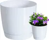 A white planter with a saucer next to a smaller white pot containing a purple orchid. Voir les images du produit