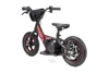 A red and black electric balance bike for children, shown from a three-quarter side view against a white background. Produktbild-Vorschau