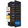 A black wine refrigerator with wooden shelves and blue interior lighting, shown with an open door. Several award badges are on the left side of the refrigerator, and a blue circular overlay with text is on the bottom right. Produktbild-Vorschau