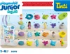A grid of numbered Playmobil Junior Aqua figures and accessories on a sandy beach background. Náhľad obrázku produktu