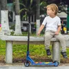 A young boy sits on a park bench next to a blue scooter. Náhľad obrázku produktu