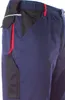 A close-up view of the side pocket and waistband of a pair of navy work trousers. Produktbild-Vorschau