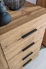A close-up view of a wooden dresser with black handles. Voir les images du produit