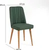 A green upholstered chair with wooden legs is shown against a white background, with dimensions indicated by text overlays. Produktbild-Vorschau