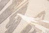 A close-up view of a textured rug with a geometric pattern in shades of beige, cream, gray, and brown. Náhled obrázku produktu