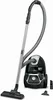 A black and silver Rowenta vacuum cleaner is shown with its hose and attachments against a white background. Produktbild-Vorschau