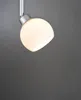 A close-up shot of a modern, white glass pendant light with a silver fixture against a dark gray background. Náhľad obrázku produktu